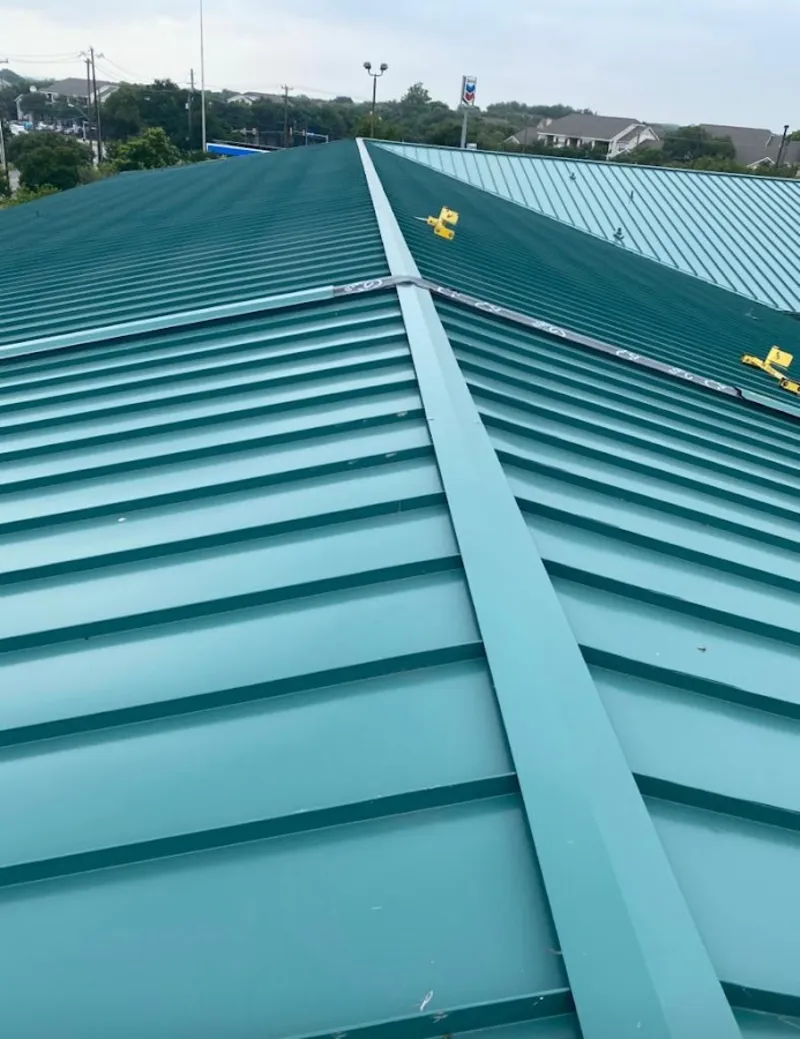 Green commercial metal roof ridge and valley for Metal Roof Repair in Boylston